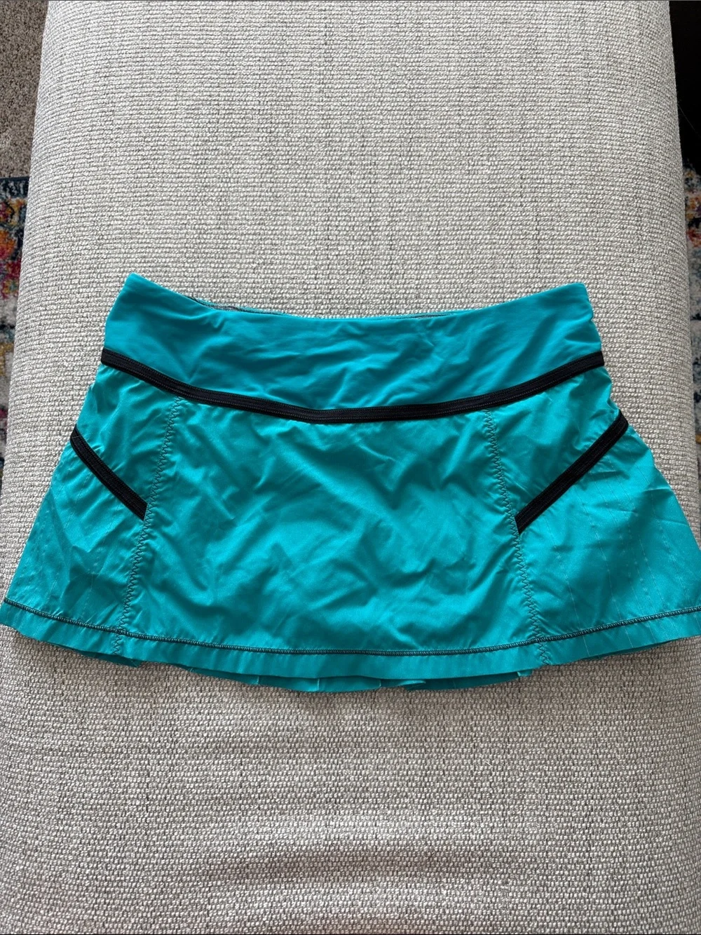 lululemon athletica turquoise pleated skater skirt with black trim